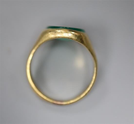 An early 20th century 18ct gold, and intaglio chrysophase? oval ring, carved with the head of a lady to dexter, size J, gross 5.6